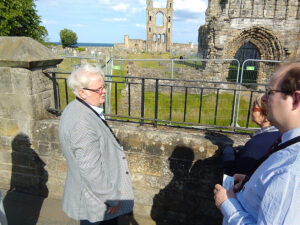 William Hyland leading the walking tour past St Andrews Castle